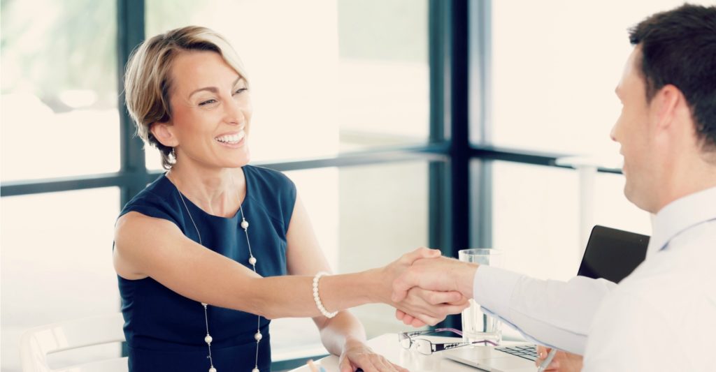 Business woman shaking hands with someone